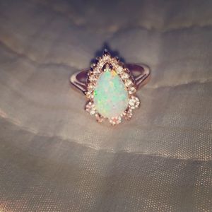 Gold plated opal simulated ring.